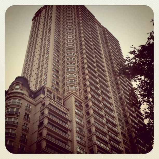 architecture, building exterior, built structure, transfer print, low angle view, auto post production filter, city, office building, modern, tall - high, skyscraper, building, tower, clear sky, window, tall, sky, day, outdoors, no people