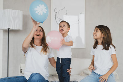 Smiling woman with balloons