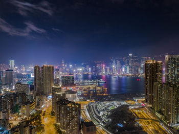 High angle view of illuminated city buildings at night