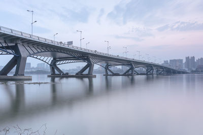 Bridge over river against sky