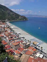 High angle view of townscape by sea