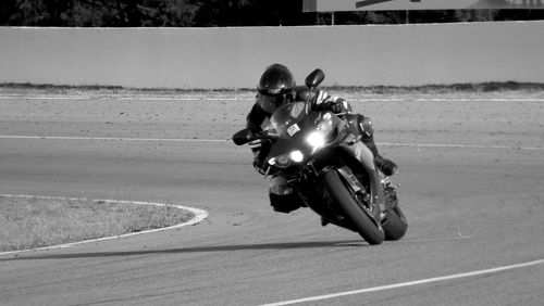 Man riding motorcycle on road