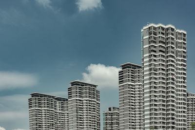 Low angle view of modern buildings against sky