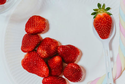 High angle view of strawberries on table