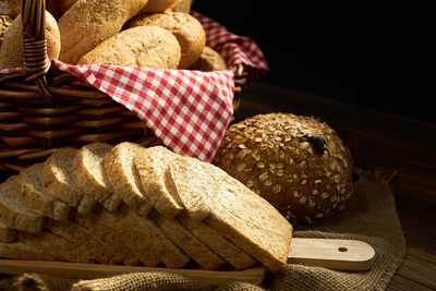 Close-up of wicker basket on cutting board