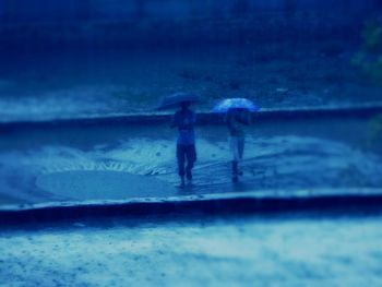 Woman standing by railing