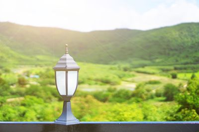 Vintage lamp with nautre landscape mountain background