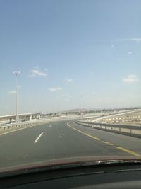 Road seen through car windshield
