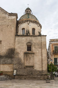 Low angle view of old building against sky