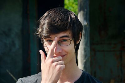 Close-up portrait of teenage boy wearing eyeglasses