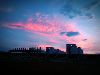 Silhouette of built structure at sunset