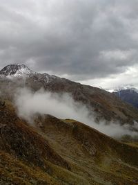 Scenic view of landscape against cloudy sky