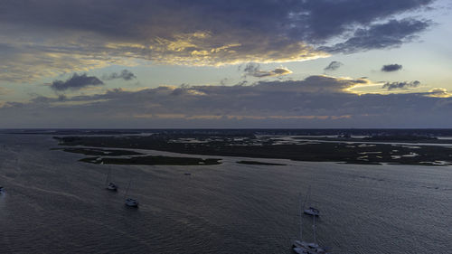 High angle view of beach against sky during sunset