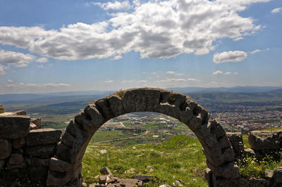 View of old ruins against cloudy sky