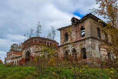 Low angle view of abandoned temple against sky