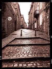 Narrow alley along buildings