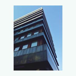 Low angle view of modern building against clear sky