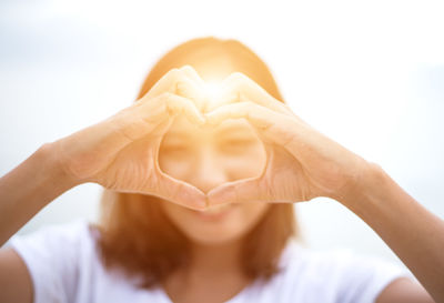 Close-up of woman hand holding heart shape