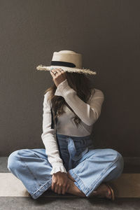 Portrait of beautiful hispanic with a hat