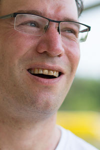 Close-up portrait of a smiling young man