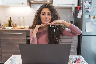 Young woman using laptop at office