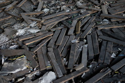 High angle view of old wooden planks on floor in abandoned building