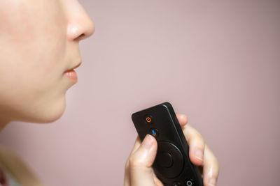 Close-up of man using mobile phone