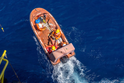 High angle view of boat floating on sea