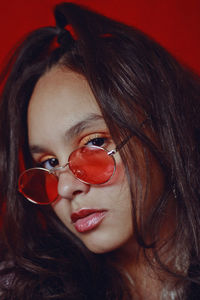 Close-up portrait of teenage girl wearing sunglasses