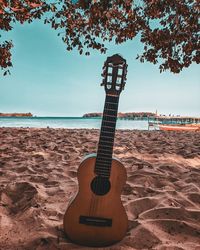 View of guitar on beach