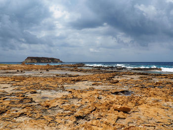 Scenic view of beach against sky