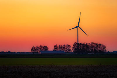 Scenic view of field against sky during sunset