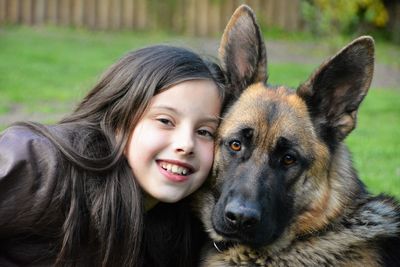 Portrait of cute girl with dog