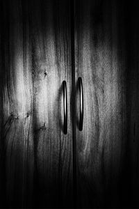 Close-up of human hand on metal door