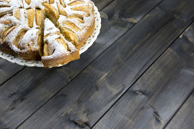 High angle view of cake on hardwood floor