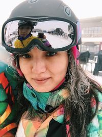 Portrait of woman wearing sunglasses in winter