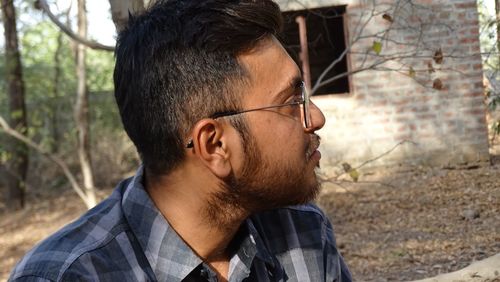 Portrait of young man looking away