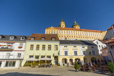 Building exterior against clear blue sky