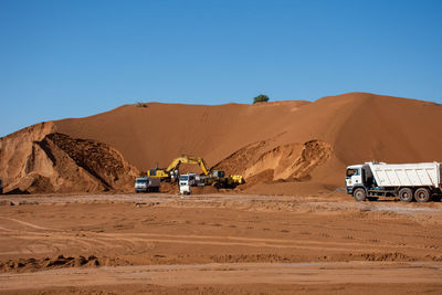 Scenic view of desert against clear sky