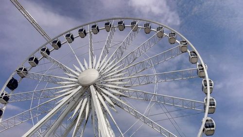 Low angle view of ferris wheel against sky