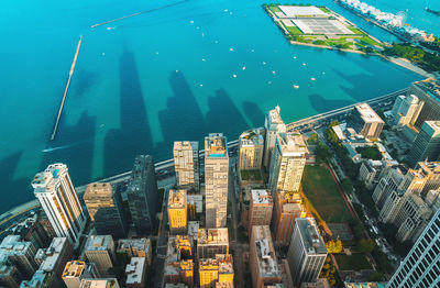 Aerial view of city by sea