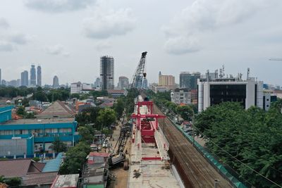 High angle view of buildings in city against sky