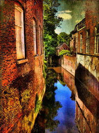 View of canal with buildings in background