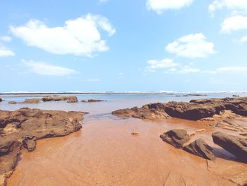 Scenic view of beach against sky