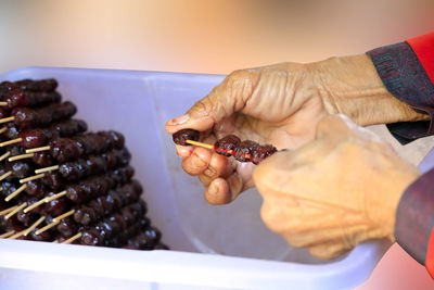 Close-up of person preparing food