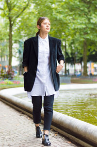 Young woman walking in park