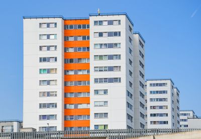 Low angle view of buildings against blue sky