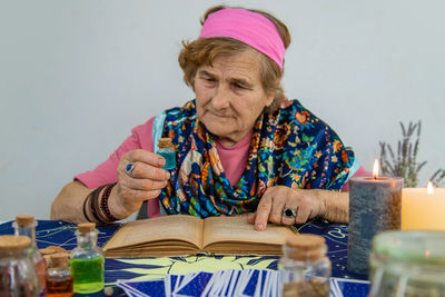 Portrait of smiling friends sitting on table