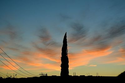 Silhouette of building during sunset