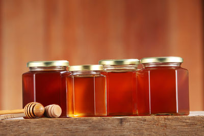 Close-up of honey in jars on table